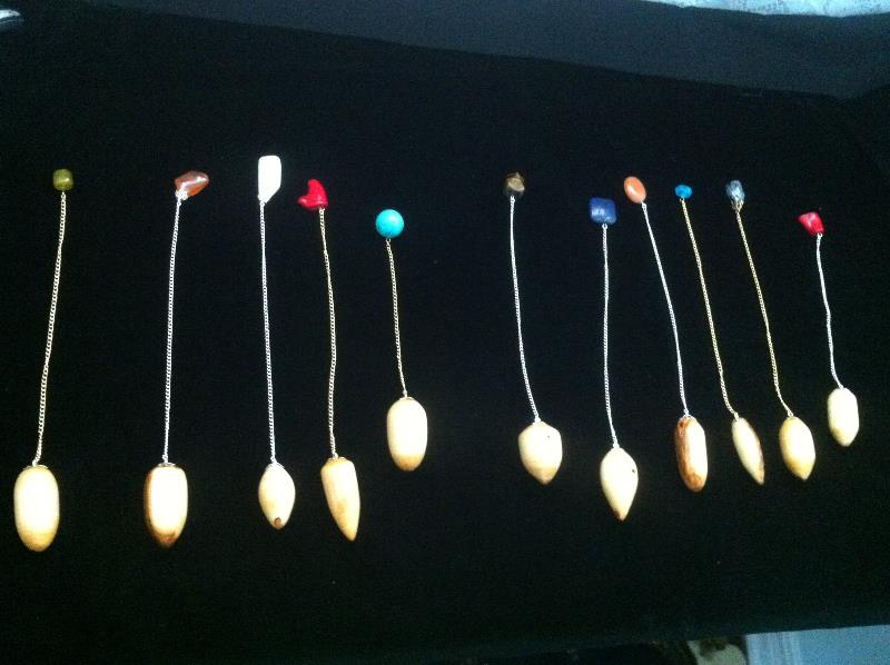 Handmade cottonwood pendulums with colorful beads, crafted by Jim Williams, ideal for meditation and energy balancing.