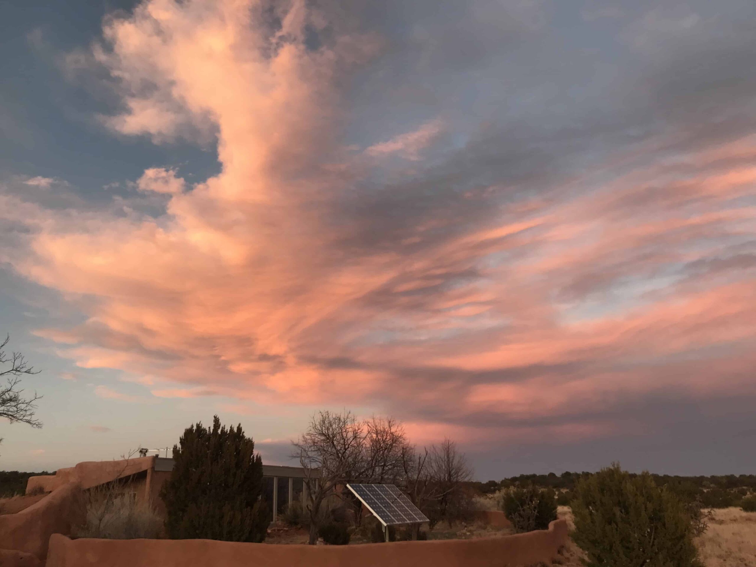 Cloud formations in the desert symbolizing the way premonitions drift in like daydreams