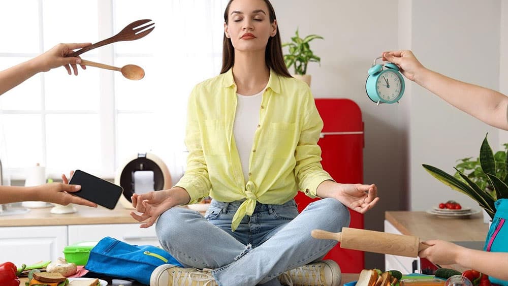 woman meditating with several stimuli around her 