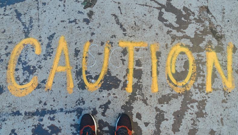 omage with the caution word painted on the ground